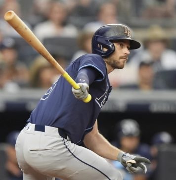 Tampa Bay Rays' Brandon Lowe hits an RBI double during the third inning of a baseball game against the New York Yankees Wednesday, July 30, 2025, in New York. (AP Photo/Frank Franklin II)