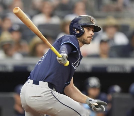 Tampa Bay Rays' Brandon Lowe hits an RBI double during the third inning of a baseball game against the New York Yankees Wednesday, July 30, 2025, in New York. (AP Photo/Frank Franklin II)