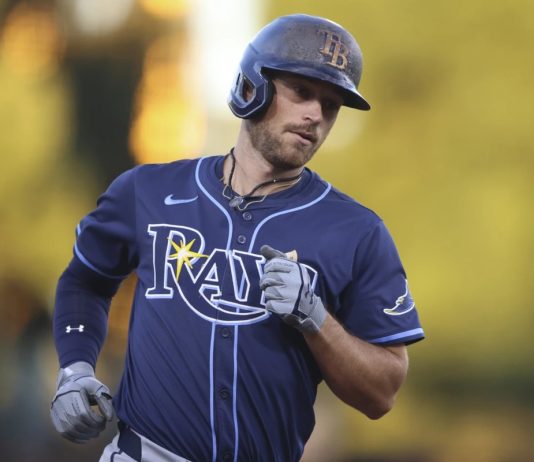 Tampa Bay Rays' Brandon Lowe jogs around the bases after hitting a two-run home run during the second inning of a baseball game against the Athletics, Wednesday, Aug. 13, 2025, in West Sacramento, Calif. (AP Photo/Scott Marshall)