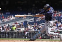 Tampa Bay Rays designated hitter Brandon Lowe hits a grand slam against the Washington Nationals during the second inning of a baseball game at Nationals Park, Sunday, Aug. 31, 2025, in Washington. (AP Photo/Jess Rapfogel)