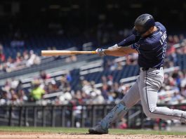 Tampa Bay Rays designated hitter Brandon Lowe hits a grand slam against the Washington Nationals during the second inning of a baseball game at Nationals Park, Sunday, Aug. 31, 2025, in Washington. (AP Photo/Jess Rapfogel)