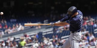Tampa Bay Rays designated hitter Brandon Lowe hits a grand slam against the Washington Nationals during the second inning of a baseball game at Nationals Park, Sunday, Aug. 31, 2025, in Washington. (AP Photo/Jess Rapfogel)