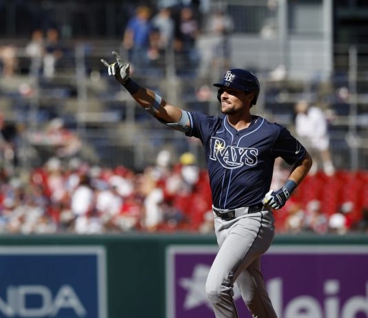 Tampa Bay Rays' Josh Lowe gestures as he runs the bases after hitting a three-run home run against Washington Nationals pitcher Jake Irvin, which scored Brandon Lowe and Junior Caminero, during the first inning of a baseball game, Saturday, Aug. 30, 2025, in Washington. (AP Photo/Terrance Williams)