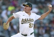 Athletics pitcher Jacob Lopez throws to an Tampa Bay Rays batter during the first inning of a baseball game, Tuesday, Aug. 12, 2025, in West Sacramento, Calif. (AP Photo/Scott Marshall)