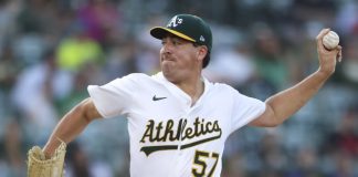 Athletics pitcher Jacob Lopez throws to an Tampa Bay Rays batter during the first inning of a baseball game, Tuesday, Aug. 12, 2025, in West Sacramento, Calif. (AP Photo/Scott Marshall)