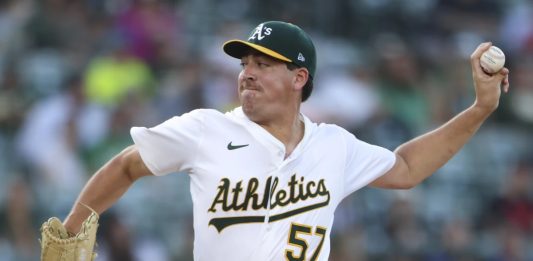 Athletics pitcher Jacob Lopez throws to an Tampa Bay Rays batter during the first inning of a baseball game, Tuesday, Aug. 12, 2025, in West Sacramento, Calif. (AP Photo/Scott Marshall)