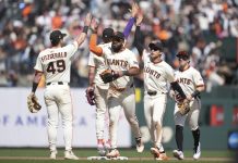 San Francisco Giants ' Tyler Fitzgerald, left, celebrates with Willy Adames, middle rear, Heliot Ramos, middle, Jung Hoo Lee, second from right, and Drew Gilbert after a baseball game against the Tampa Bay Rays in San Francisco, Sunday, Aug. 17, 2025. (AP Photo/Jeff Chiu)