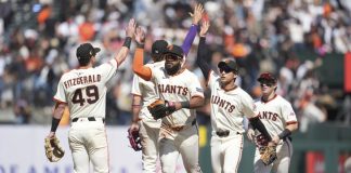 San Francisco Giants ' Tyler Fitzgerald, left, celebrates with Willy Adames, middle rear, Heliot Ramos, middle, Jung Hoo Lee, second from right, and Drew Gilbert after a baseball game against the Tampa Bay Rays in San Francisco, Sunday, Aug. 17, 2025. (AP Photo/Jeff Chiu)