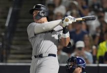 New York Yankees' Aaron Judge watches his solo home run off Tampa Bay Rays pitcher Shane Baz during the first inning of a baseball game Tuesday, Aug. 19, 2025, in Tampa, Fla. (AP Photo/Chris O'Meara)