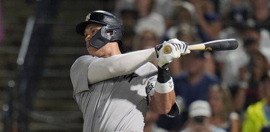 New York Yankees' Aaron Judge watches his solo home run off Tampa Bay Rays pitcher Shane Baz during the first inning of a baseball game Tuesday, Aug. 19, 2025, in Tampa, Fla. (AP Photo/Chris O'Meara)