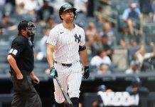 New York Yankees' Giancarlo Stanton reacts after hitting a home run in the first inning of a baseball game against the Tampa Bay Rays, Thursday, July 31, 2025, in New York. (AP Photo/Heather Khalifa)
