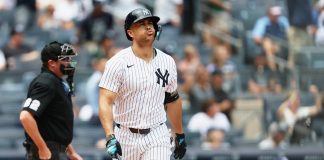 New York Yankees' Giancarlo Stanton reacts after hitting a home run in the first inning of a baseball game against the Tampa Bay Rays, Thursday, July 31, 2025, in New York. (AP Photo/Heather Khalifa)
