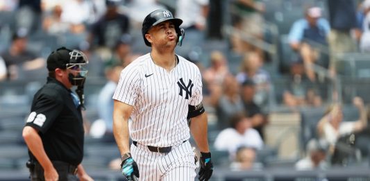 New York Yankees' Giancarlo Stanton reacts after hitting a home run in the first inning of a baseball game against the Tampa Bay Rays, Thursday, July 31, 2025, in New York. (AP Photo/Heather Khalifa)