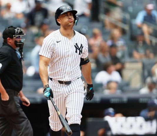 New York Yankees' Giancarlo Stanton reacts after hitting a home run in the first inning of a baseball game against the Tampa Bay Rays, Thursday, July 31, 2025, in New York. (AP Photo/Heather Khalifa)