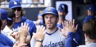 Los Angeles Dodgers' Freddie Freeman (5) celebrates after scoring on a single by Andy Pages during the sixth inning of a baseball game against the Tampa Bay Rays, Sunday, Aug. 3, 2025, in Tampa, Fla. (AP Photo/Jason Behnken)