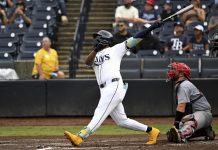 Tampa Bay Rays' Junior Caminero hits a grand slam during the fifth inning of a baseball game against the St. Louis Cardinals, Sunday, Aug. 24, 2025, in Tampa, Fla. (AP Photo/Jason Behnken)