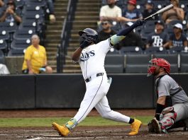 Tampa Bay Rays' Junior Caminero hits a grand slam during the fifth inning of a baseball game against the St. Louis Cardinals, Sunday, Aug. 24, 2025, in Tampa, Fla. (AP Photo/Jason Behnken)