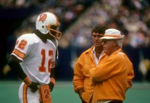 Quarterback Doug Williams #12 of the Tampa Bay Buccaneers talking with Head Coach John McKay (R) circa 1978 during an NFL football game. Williams played for the Buccaneers from 1978-82.AP PHOTOS