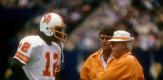 Quarterback Doug Williams #12 of the Tampa Bay Buccaneers talking with Head Coach John McKay (R) circa 1978 during an NFL football game. Williams played for the Buccaneers from 1978-82.AP PHOTOS
