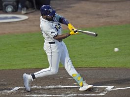 Tampa Bay Rays' Junior Caminero lines an RBI single off Seattle Mariners pitcher Bryan Woo during the first inning of a baseball game Tuesday, Sept. 2, 2025, in Tampa, Fla. (AP Photo/Chris O'Meara)
