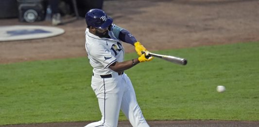 Tampa Bay Rays' Junior Caminero lines an RBI single off Seattle Mariners pitcher Bryan Woo during the first inning of a baseball game Tuesday, Sept. 2, 2025, in Tampa, Fla. (AP Photo/Chris O'Meara)