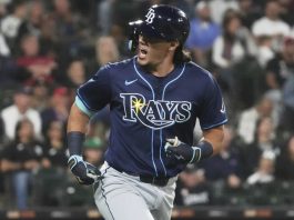 Tampa Bay Rays’ Tristan Gray reacts as he rounds the bases after hitting a solo home run during the seventh inning of a baseball game against the Chicago White Sox in Chicago, Tuesday, Sept. 9, 2025. (AP Photo/Nam Y. Huh)