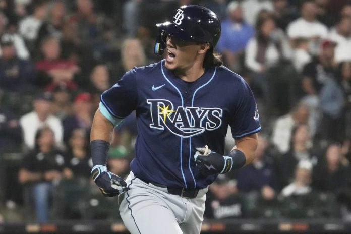 Tampa Bay Rays’ Tristan Gray reacts as he rounds the bases after hitting a solo home run during the seventh inning of a baseball game against the Chicago White Sox in Chicago, Tuesday, Sept. 9, 2025. (AP Photo/Nam Y. Huh)