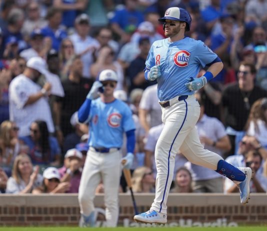 Chicago Cubs' Ian Happ (8) runs the bases after hitting a home run during the fourth inning of a baseball game against the Tampa Bay Rays, Friday, Sept. 12, 2025, in Chicago. (AP Photo/Erin Hooley)