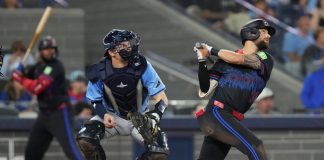 Toronto Blue Jays' Nathan Lukes (38) hits a two-run home run off Tampa Bay Rays pitcher Adrian Houser as Rays catcher Hunter Feduccia (30) looks on during fifth inning MLB baseball action in Toronto on Friday, Sept. 26, 2025. (Chris Young/The Canadian Press via AP)