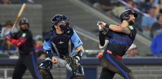 Toronto Blue Jays' Nathan Lukes (38) hits a two-run home run off Tampa Bay Rays pitcher Adrian Houser as Rays catcher Hunter Feduccia (30) looks on during fifth inning MLB baseball action in Toronto on Friday, Sept. 26, 2025. (Chris Young/The Canadian Press via AP)