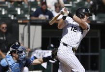 Chicago White Sox's Colson Montgomery watches his two-run single during the first inning of a baseball game against the Tampa Bay Rays, Thursday, Sept. 11, 2025, in Chicago. (AP Photo/Paul Beaty)