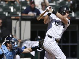 Chicago White Sox's Colson Montgomery watches his two-run single during the first inning of a baseball game against the Tampa Bay Rays, Thursday, Sept. 11, 2025, in Chicago. (AP Photo/Paul Beaty)