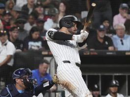Chicago White Sox's Mike Tauchman hits a two-run double during the second inning of a baseball game against the Tampa Bay Rays in Chicago, Wednesday, Sept. 10, 2025. (AP Photo/Nam Y. Huh)
