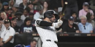Chicago White Sox's Mike Tauchman hits a two-run double during the second inning of a baseball game against the Tampa Bay Rays in Chicago, Wednesday, Sept. 10, 2025. (AP Photo/Nam Y. Huh)