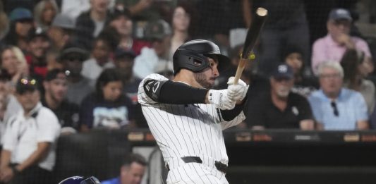 Chicago White Sox's Mike Tauchman hits a two-run double during the second inning of a baseball game against the Tampa Bay Rays in Chicago, Wednesday, Sept. 10, 2025. (AP Photo/Nam Y. Huh)