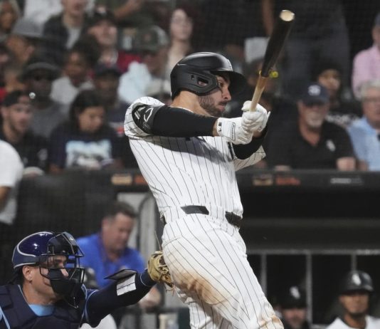 Chicago White Sox's Mike Tauchman hits a two-run double during the second inning of a baseball game against the Tampa Bay Rays in Chicago, Wednesday, Sept. 10, 2025. (AP Photo/Nam Y. Huh)