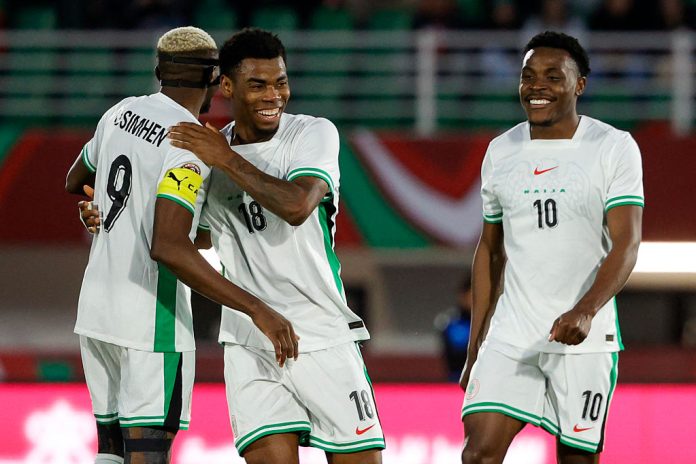 Raphael Onyedika celebrate his goal with Victor Osimhen in Nigeria's 3-1 win over Uganda